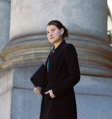 A women in black coat looking away