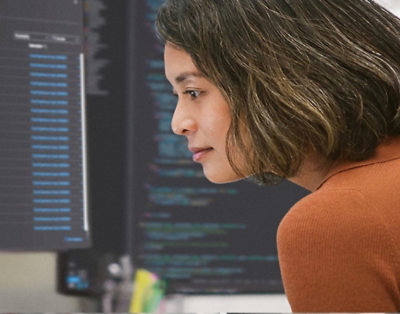 A women looking at a laptop.