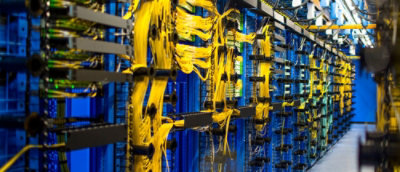 A close-up of yellow wires inside a computer server.