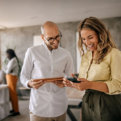 Two people discussing something using tablet