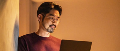 A man looking at the screen