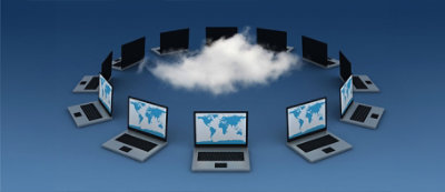 A circle of laptops and desktops surrounds a cloud, symbolizing cloud computing technology.
