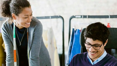 A man and women talking each other with smiling face
