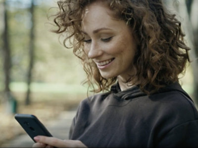 A woman looking at her phone