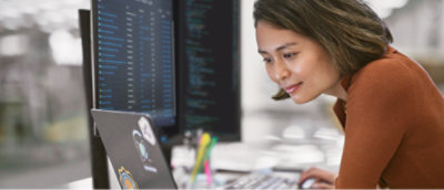 A woman looking at the computer screen