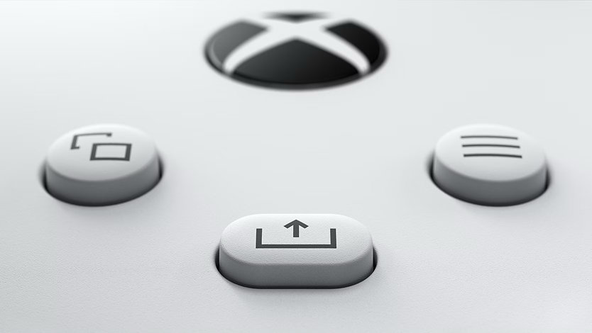 Close-up of the Share button on an XBOX wireless controller.