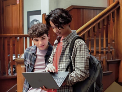 Two young person's looking at a computer