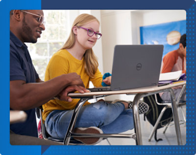 A person and another person looking at a computer.