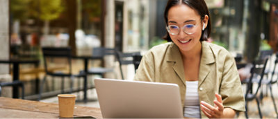 A person smiling at a computer