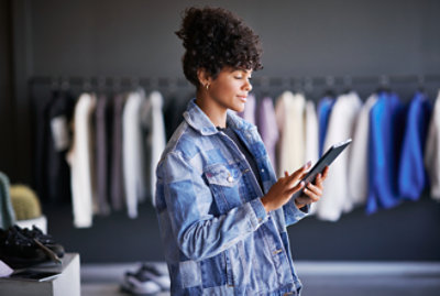 A woman holding a tablet.