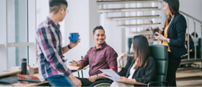 A group of people sitting around a table.