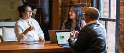 A group of people sitting at a table.