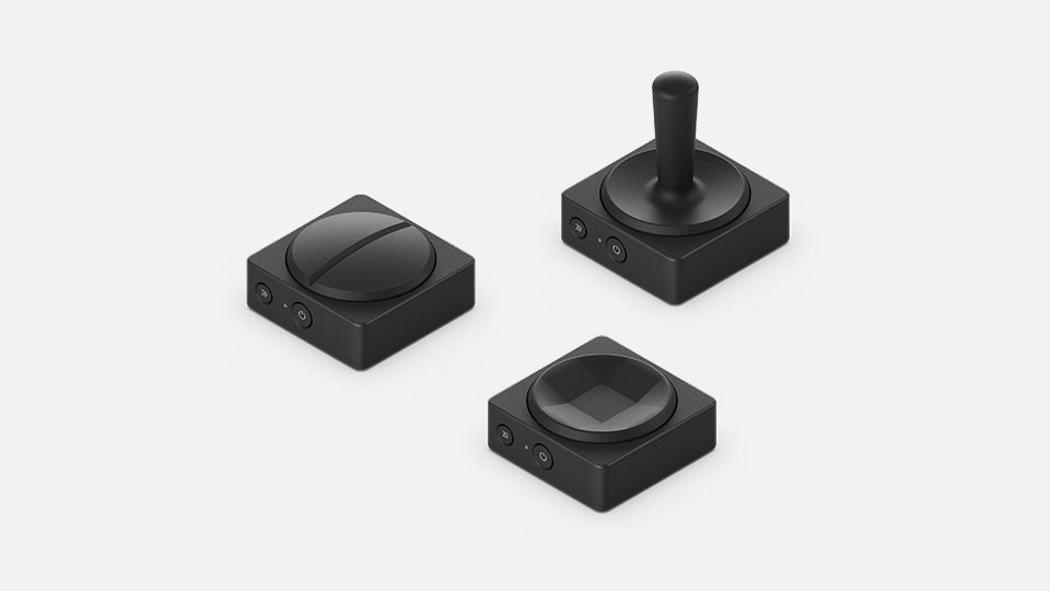 Styrknappen, joysticken eller dubbelknapparna.