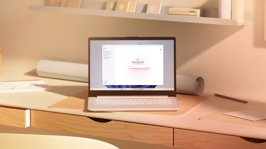 An open laptop on a desk in an office