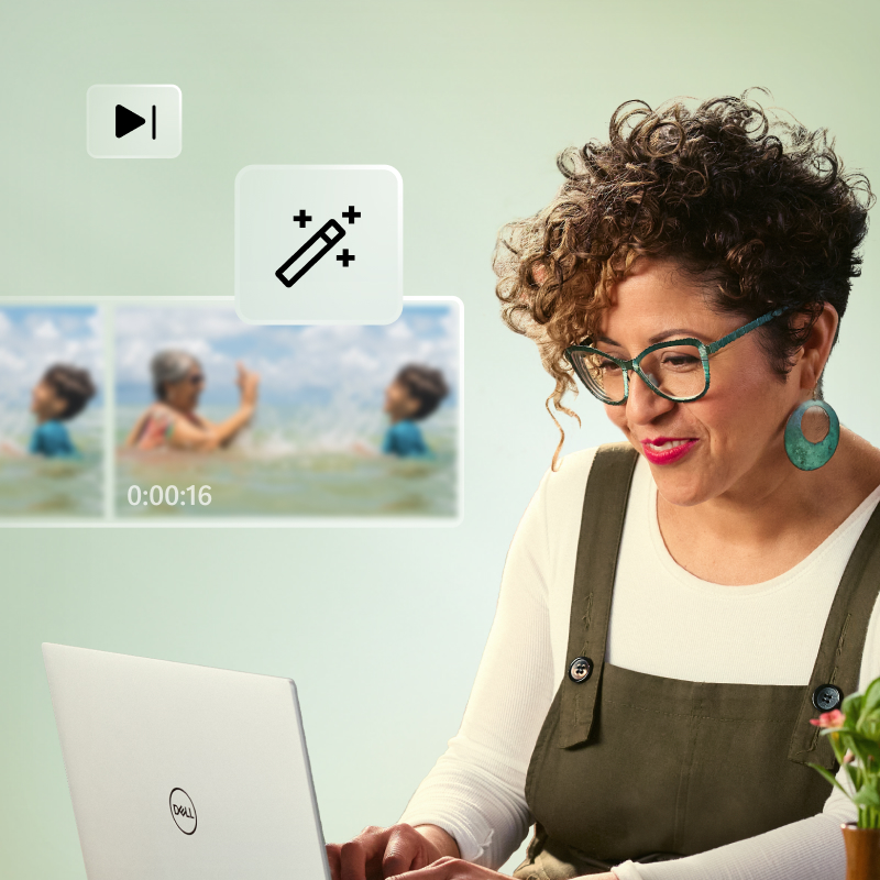 A woman typing on an open laptop with large photo editing feature icons and blurry photos on top