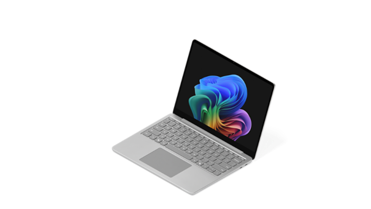 Otwarty Surface Laptop wyświetlający obraz tęczowego kwiatu