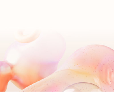 Close-up of a shiny, abstract sculpture with smooth, rounded, and translucent forms in pastel colors.