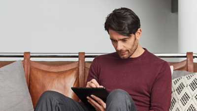 A person researching frequently asked questions on the Microsoft web site