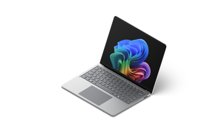 Otwarty Surface Laptop wyświetlający obraz tęczowego kwiatu