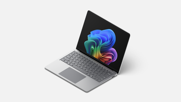 Otwarty Surface Laptop wyświetlający obraz tęczowego kwiatu