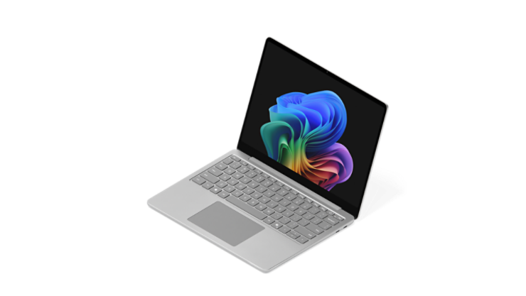 Otwarty Surface Laptop wyświetlający obraz tęczowego kwiatu