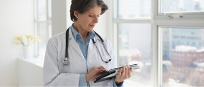 A doctor using a tablet.